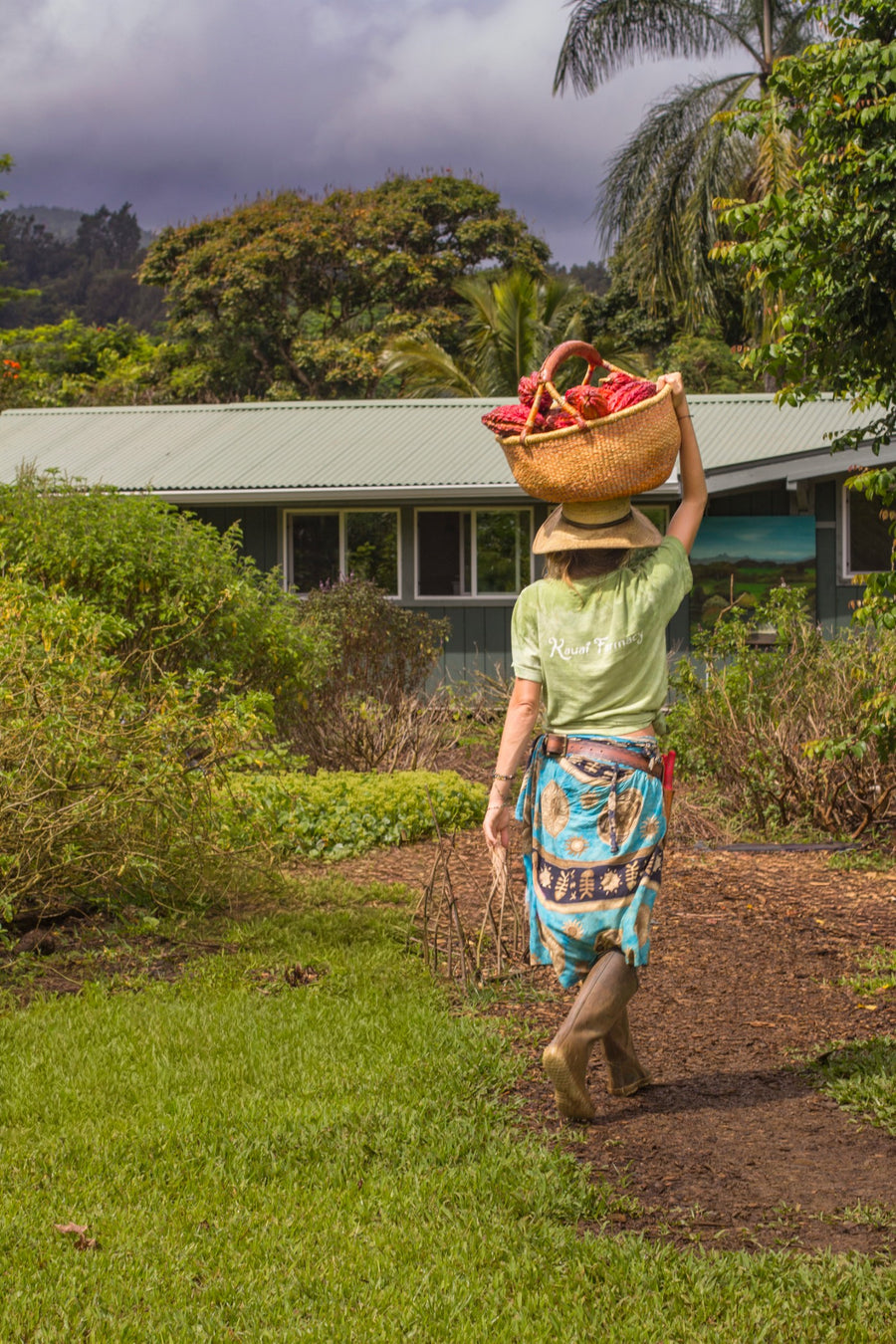 Carrying a basket of harvested flowers on her head