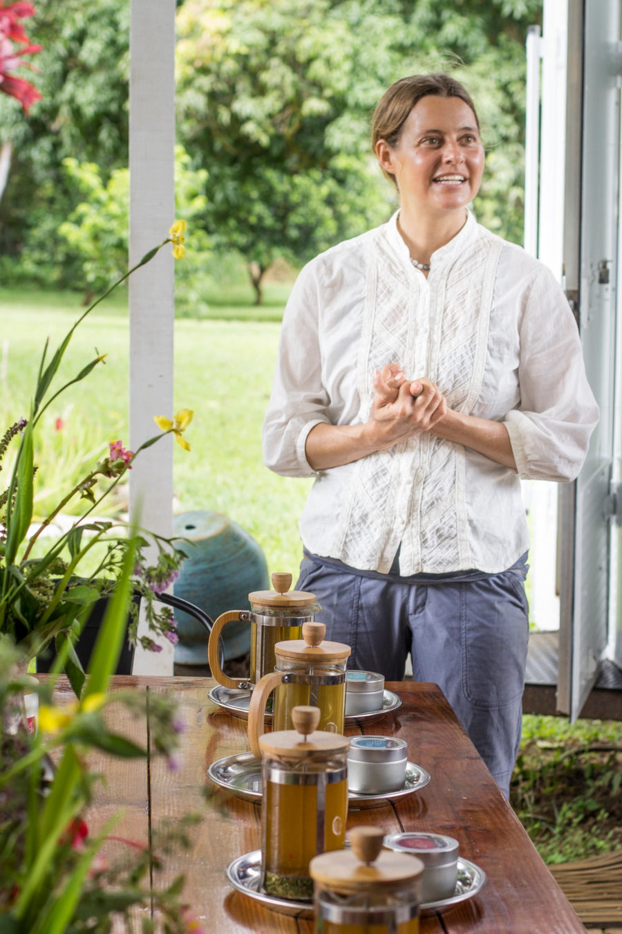 Presenting fresh-brewed tea on the lanai